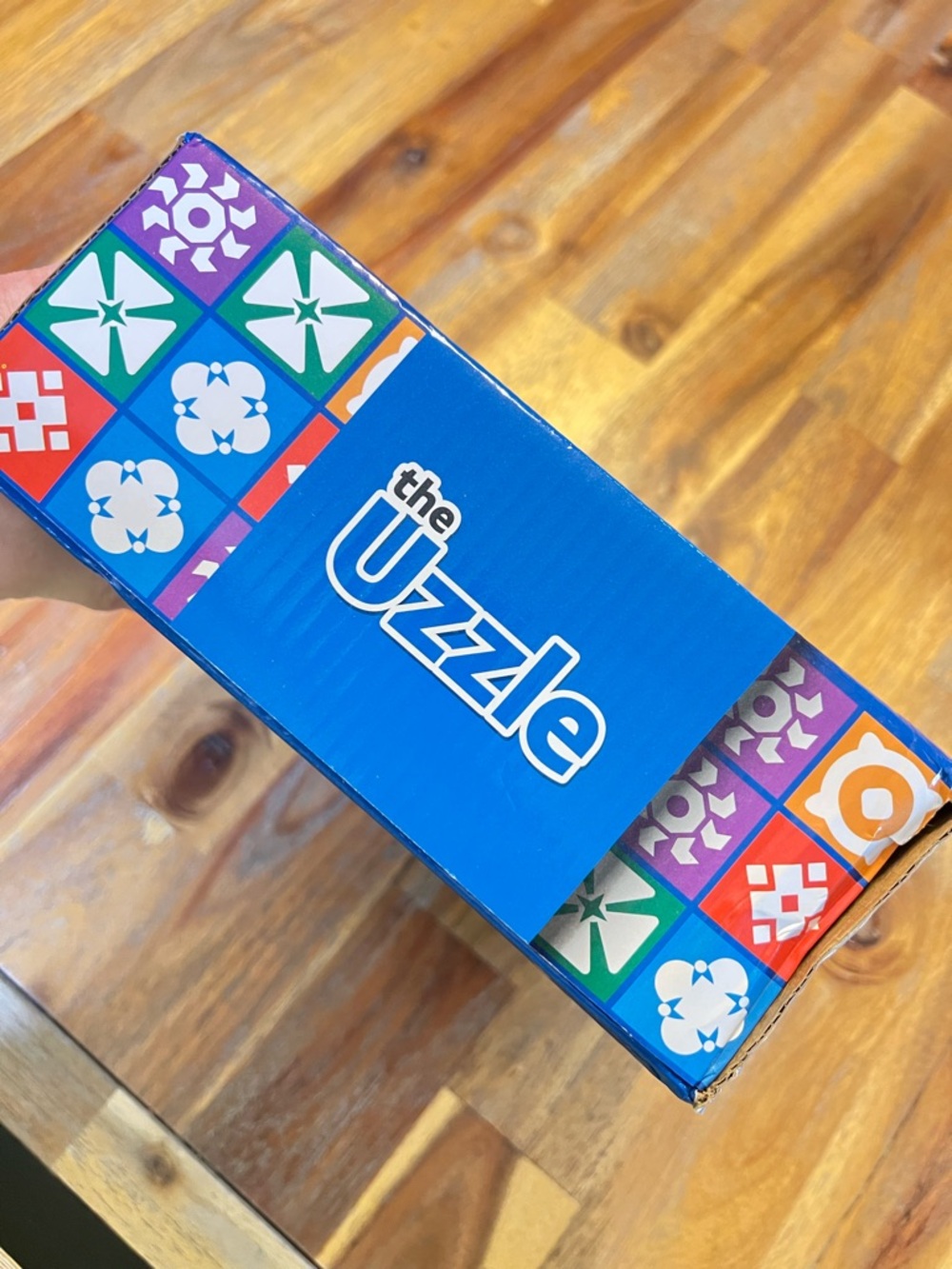 The Uzzle Puzzle Box in Bright Blue with Multicolor Tiles